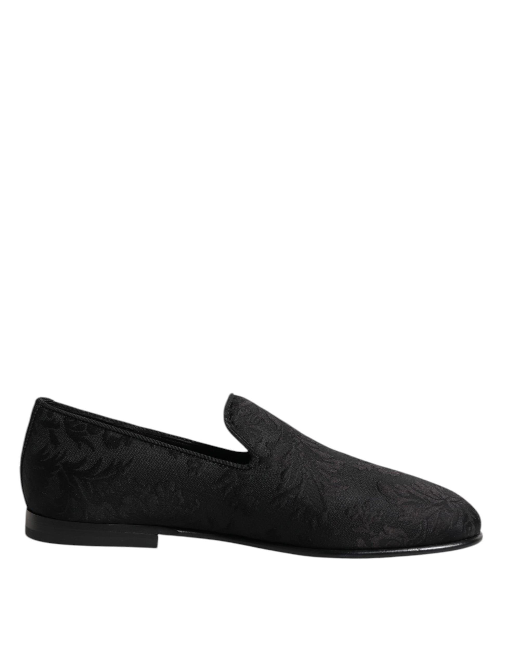 A pair of black loafers with a floral brocade pattern, designed by Dolce & Gabbana