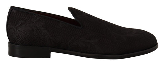 Pair of black shoes with patterned design on soles and heels