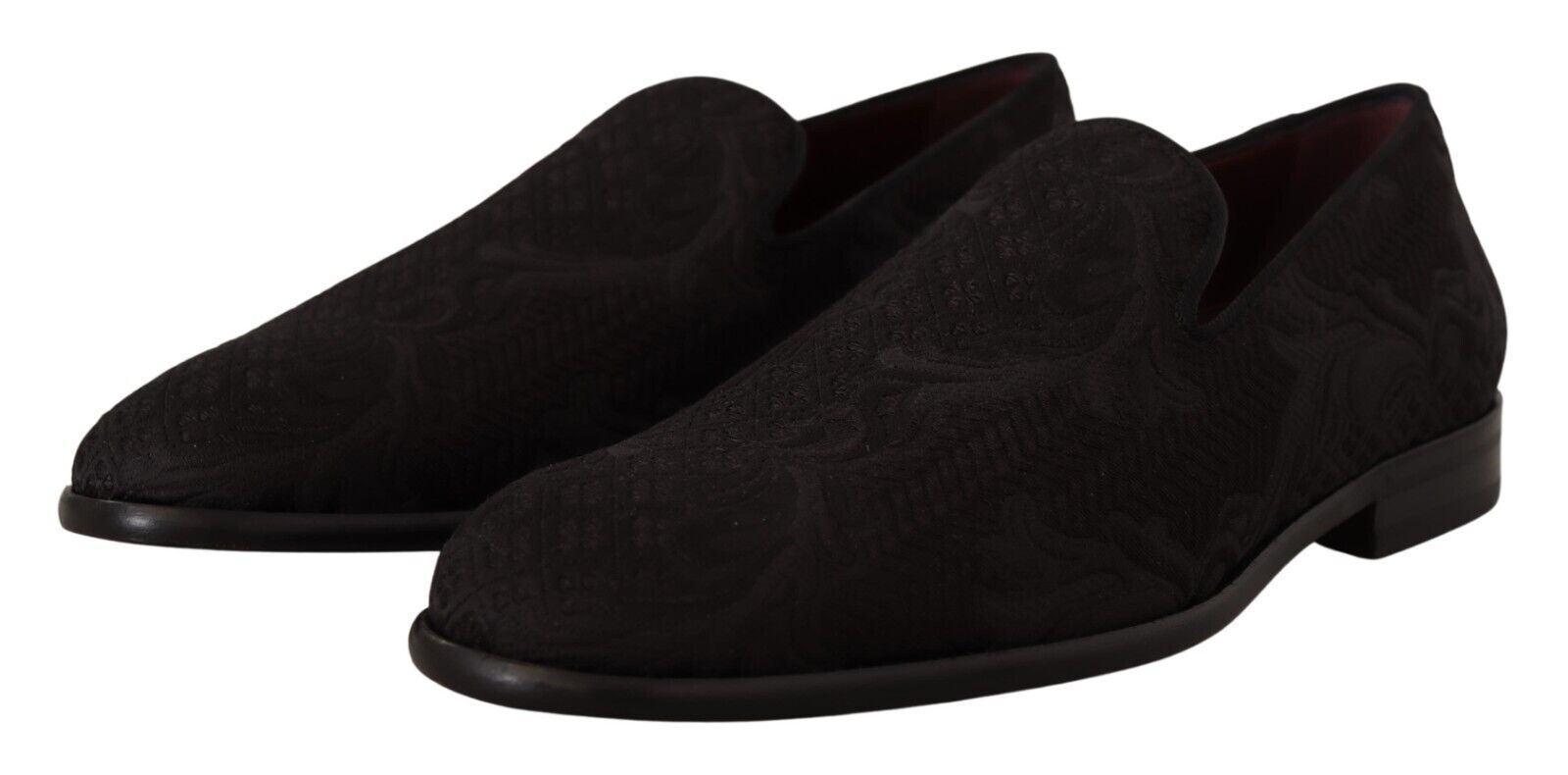 Pair of black velvet loafers with a patterned sole