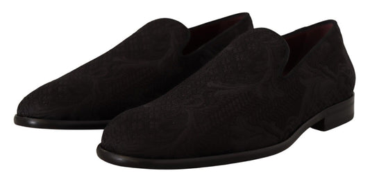 Pair of black velvet loafers with a patterned sole