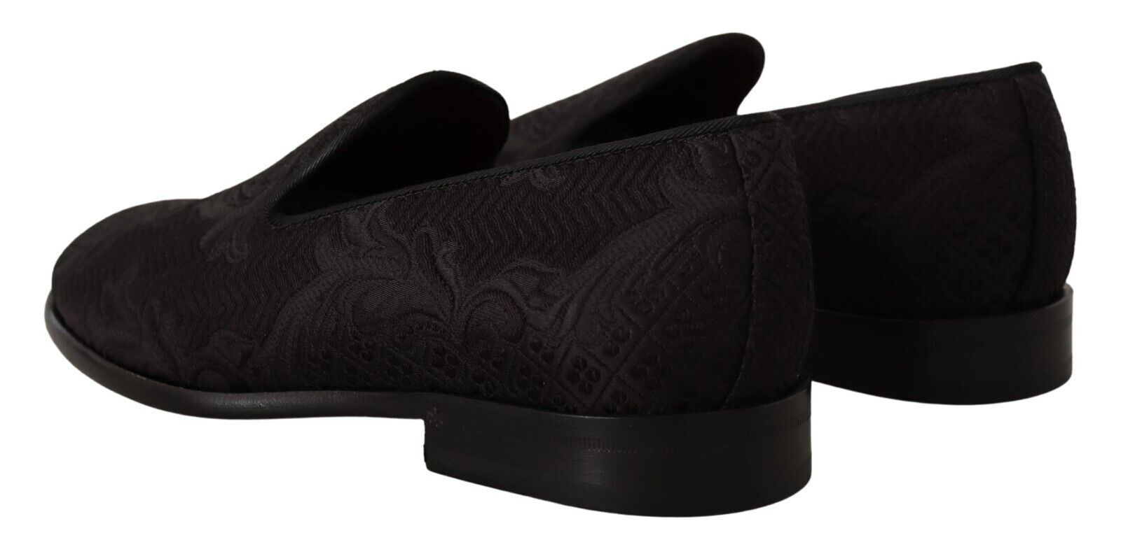 Pair of black shoes with patterned design on top and bottom