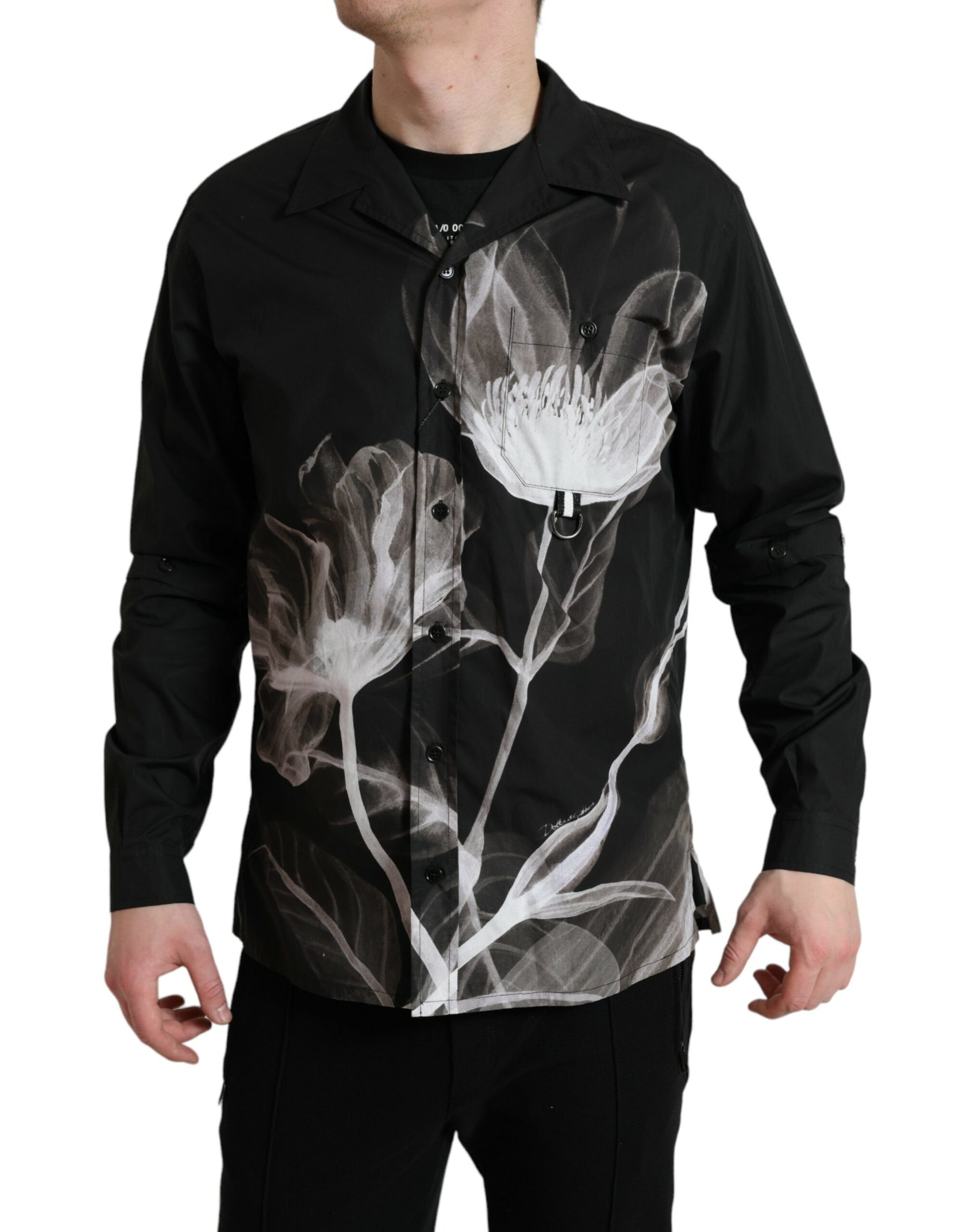 Man wearing black jacket with white flower design