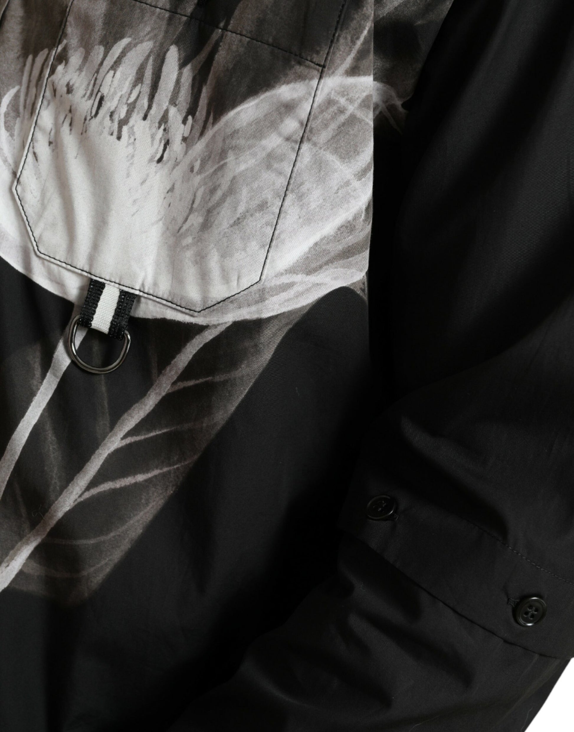Black jacket with white floral pattern on front
