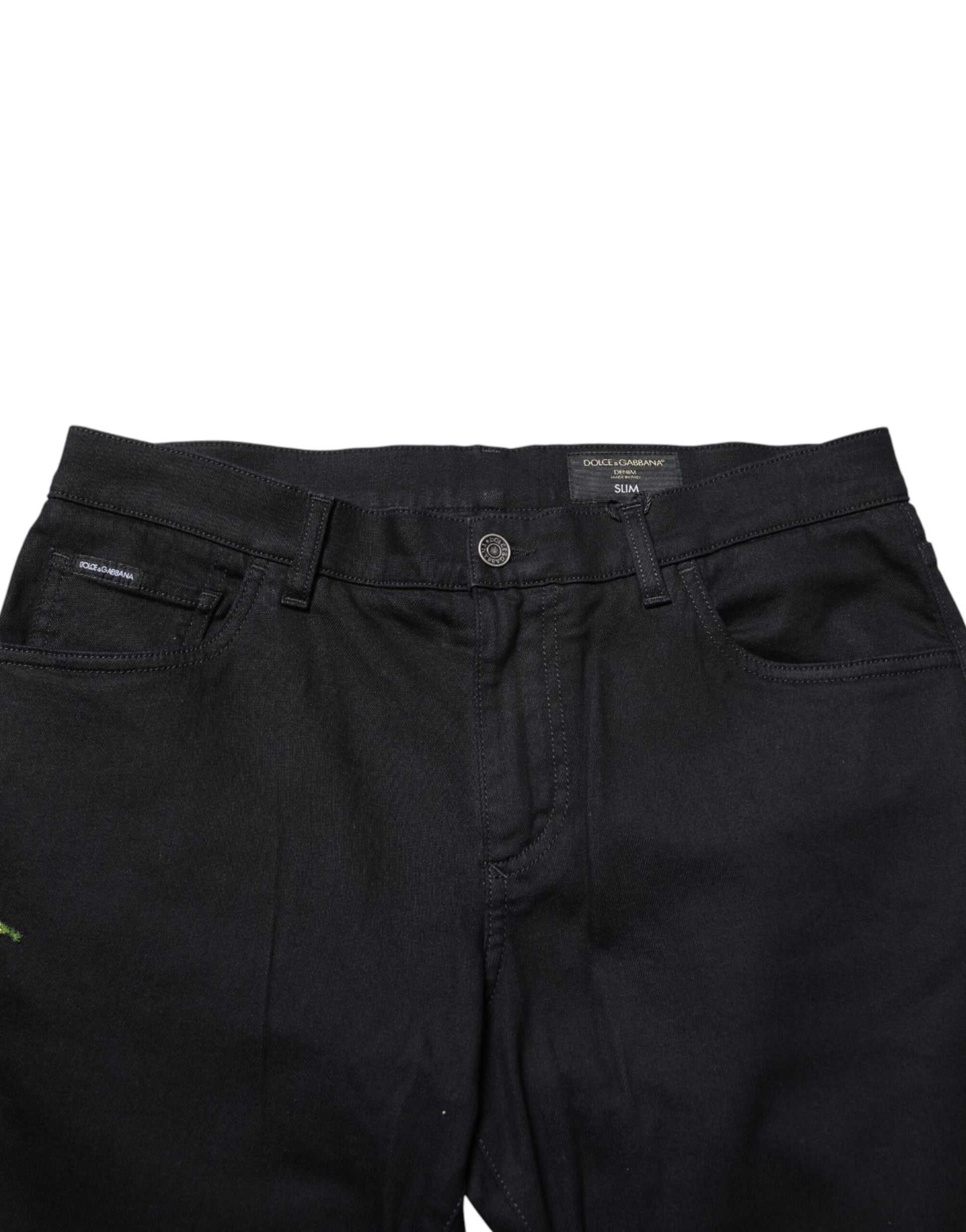 Pair of black jeans with button closure