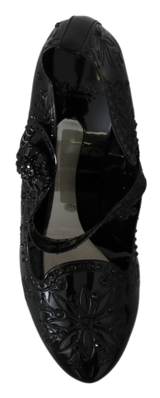 Black high heel shoe with embellishments and a strap