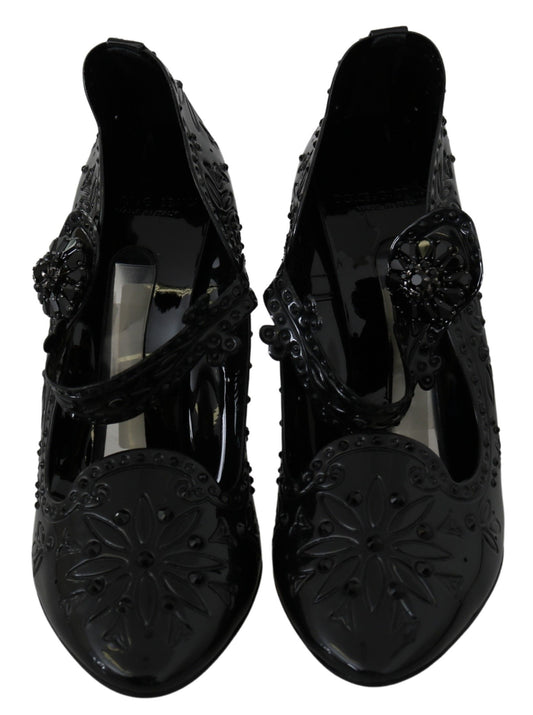 Pair of black women's shoes with embellishments and heels