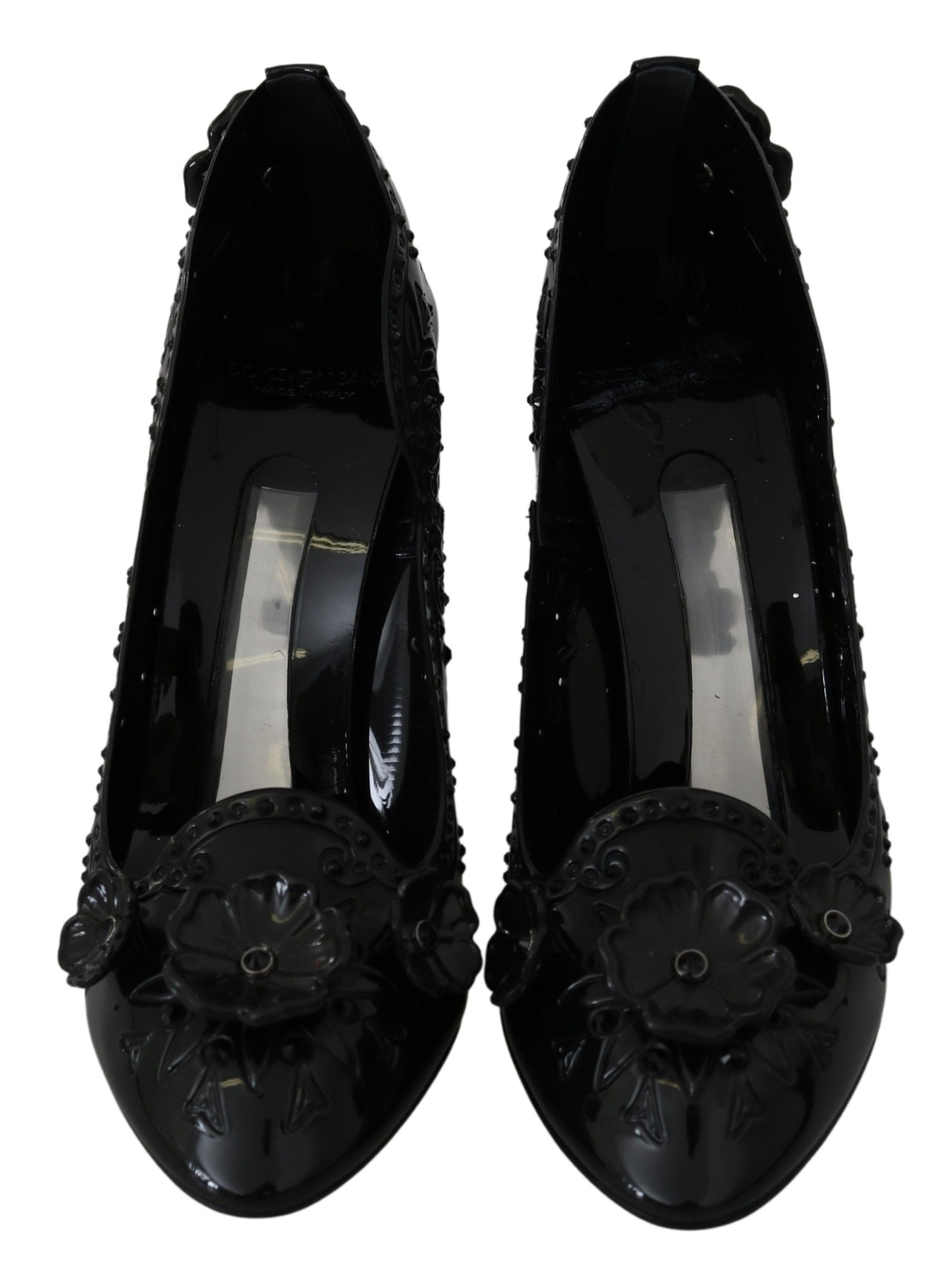 Pair of black women's shoes with embellishments and heels