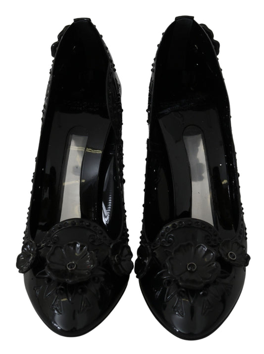 Pair of black women's shoes with embellishments and heels