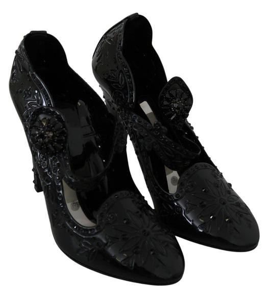 Pair of black high heel shoes with embellishments and straps