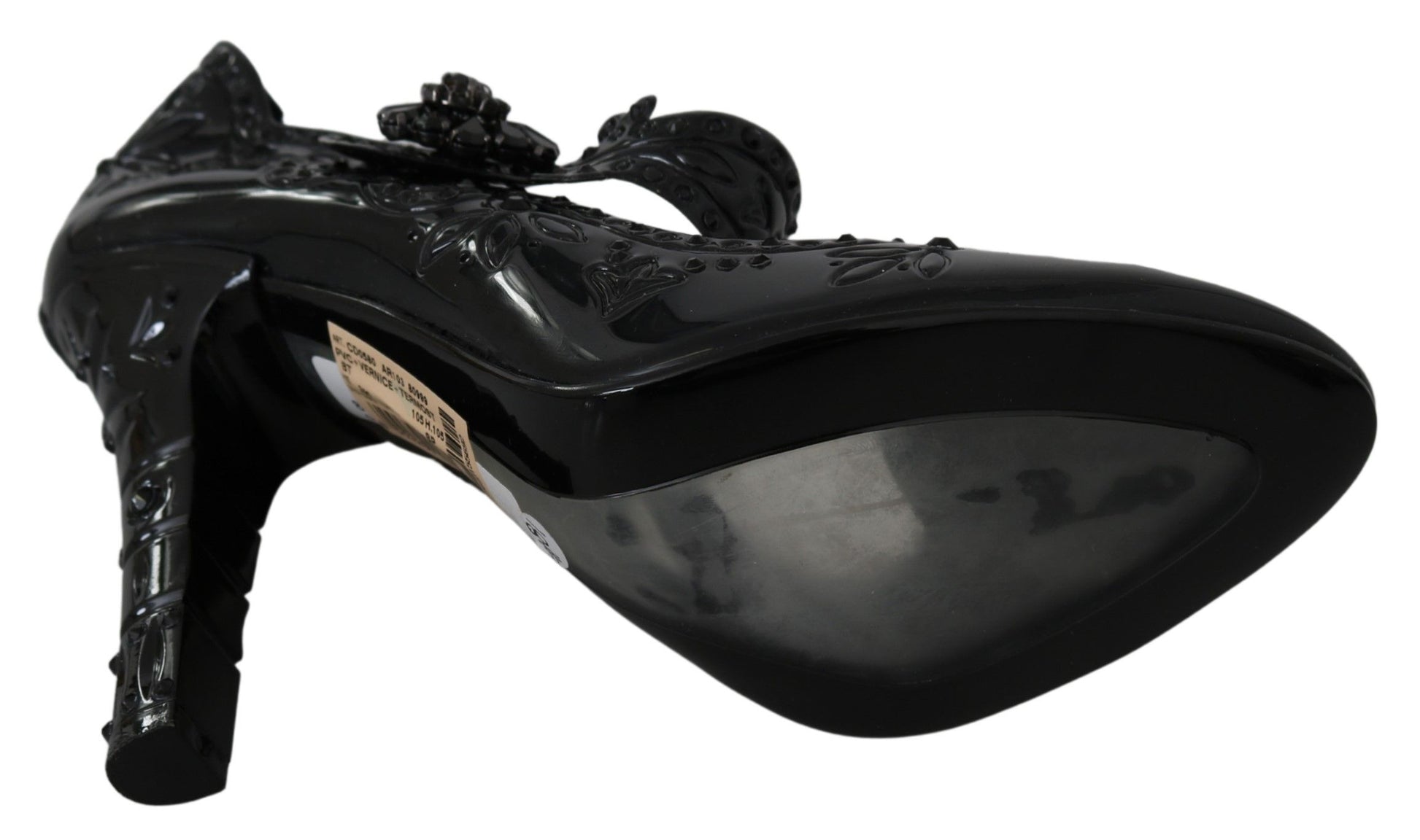 Black high heel shoe with decorative design on top and toe cap