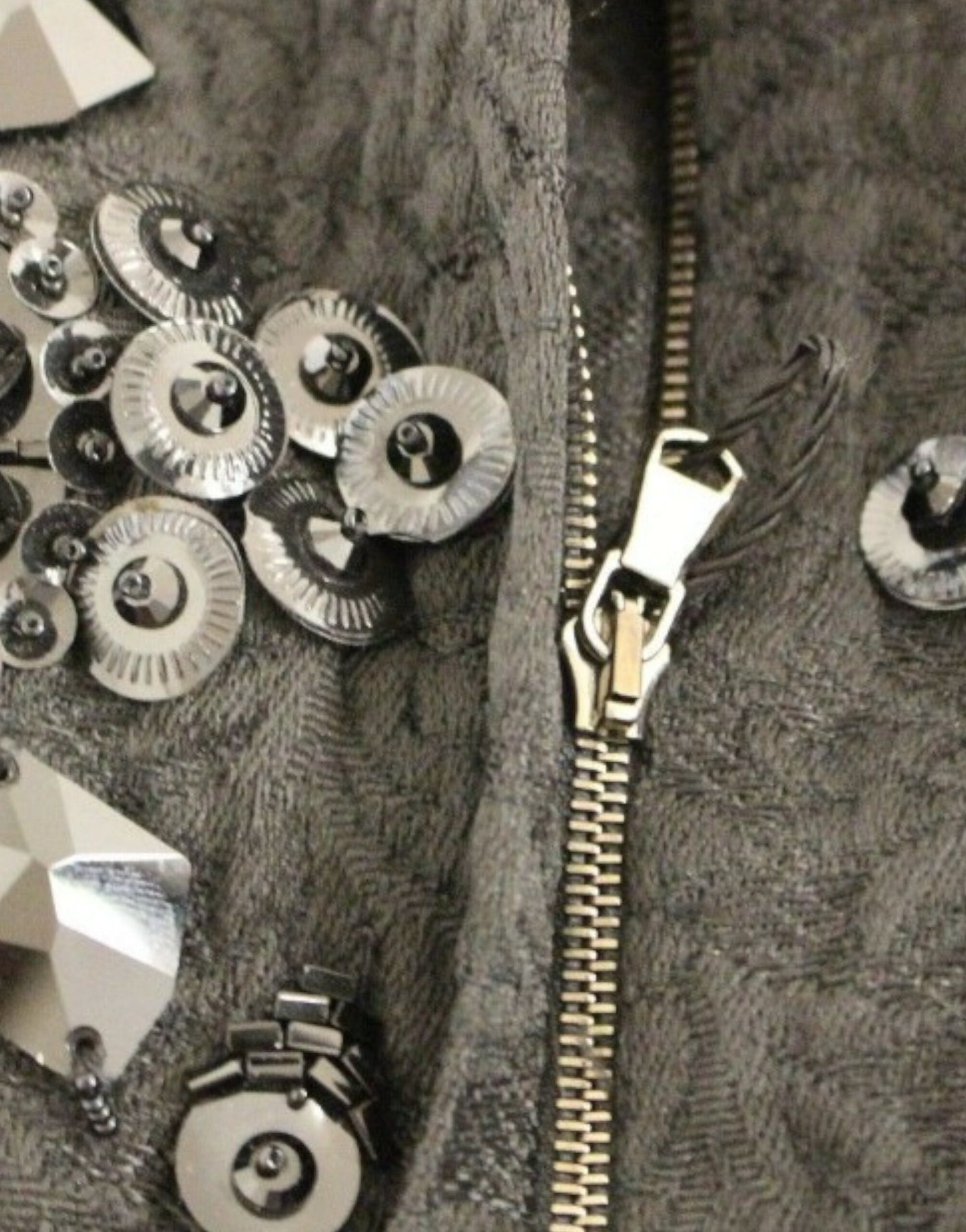 Zipper on a jacket with buttons and fabric