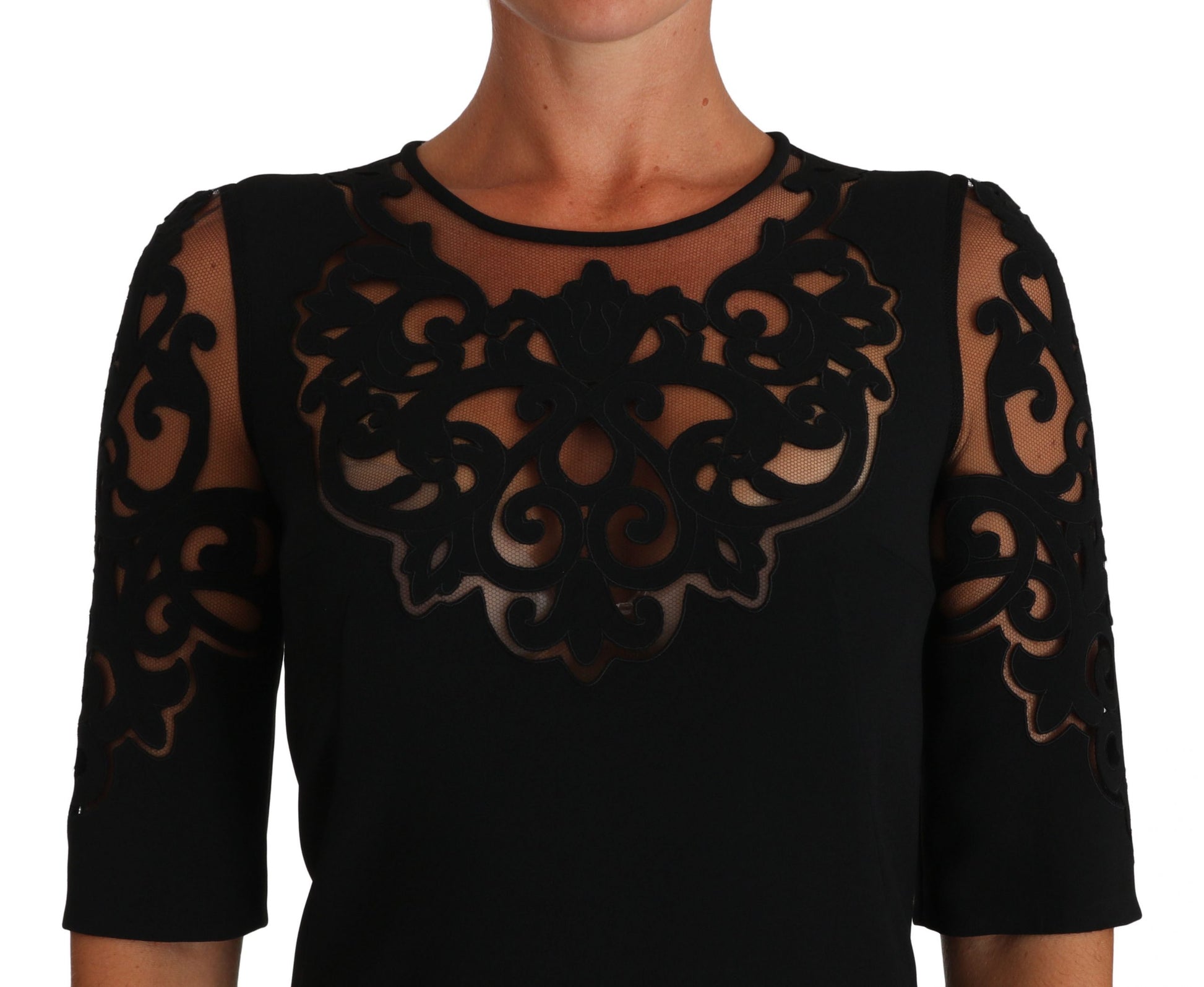 A black dress with floral cut out pattern, sleeveless and featuring a cocktail style