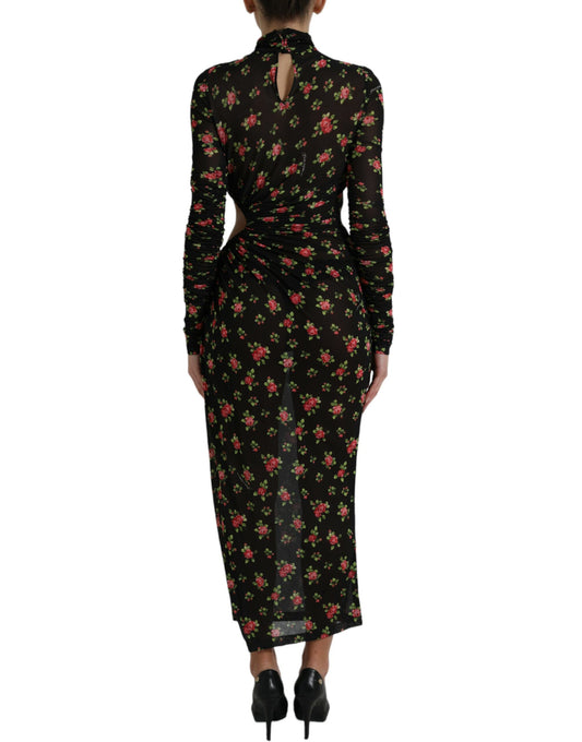 A long black dress with floral cut outs and a high neckline