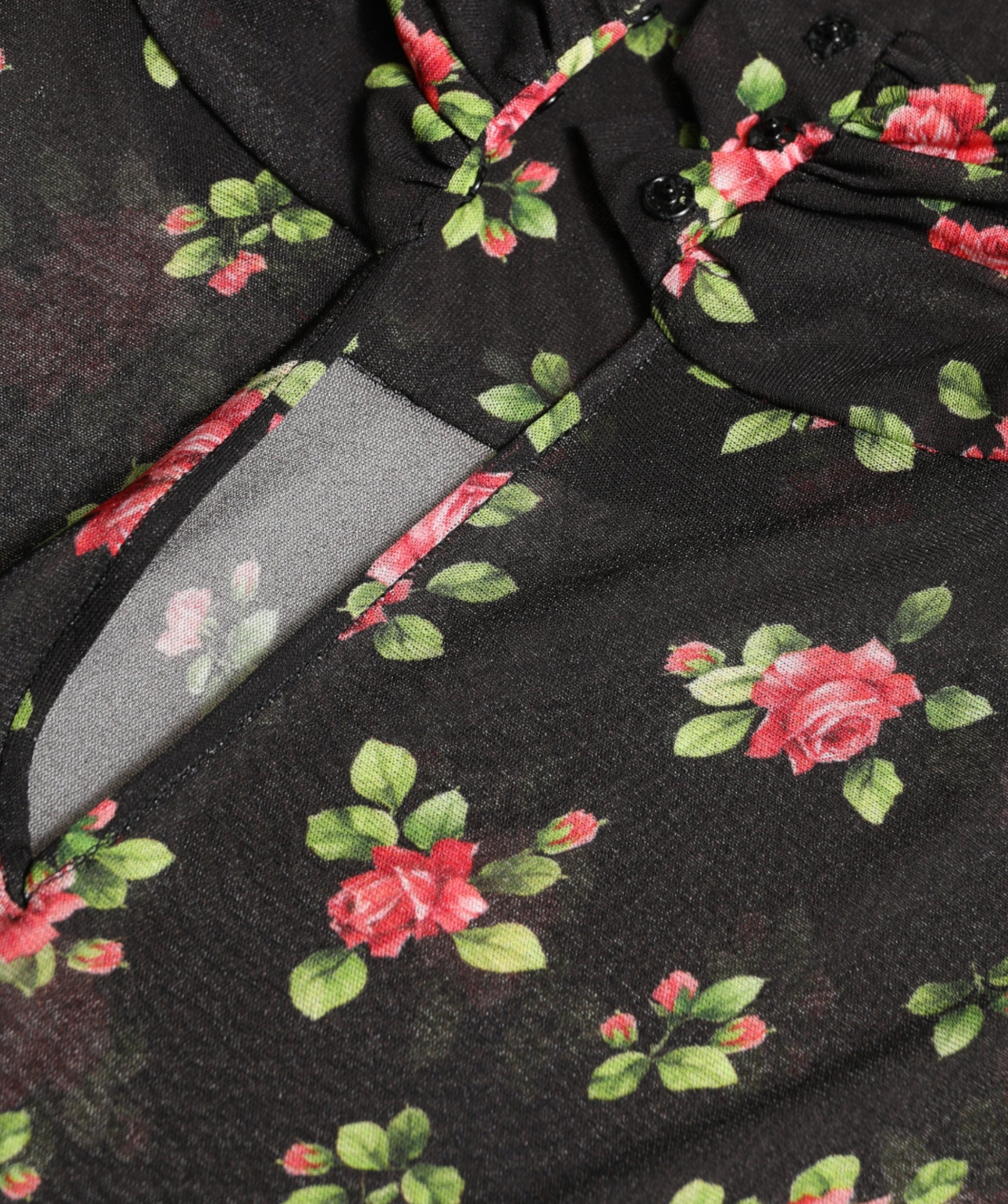 A black floral cut out sheath long maxi dress with a knife in the pocket