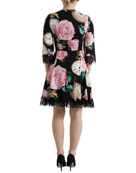 A black dress with floral embellishments and lace detailing