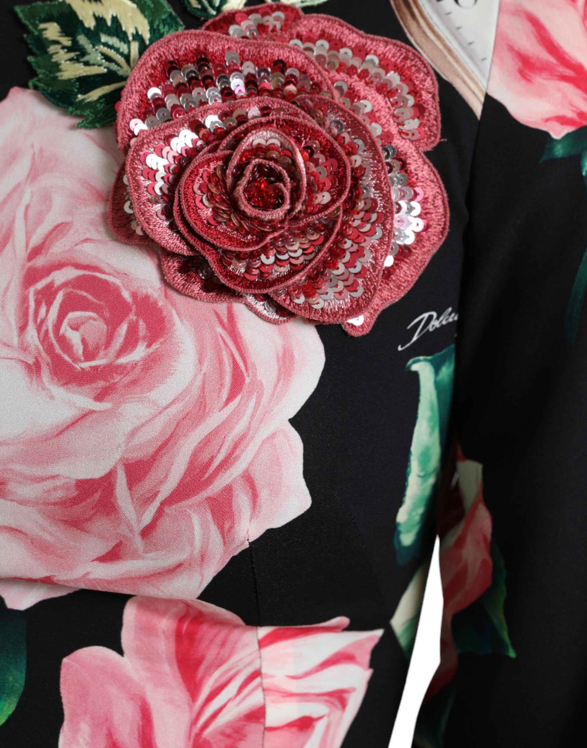 Red embellished rose on black floral dress