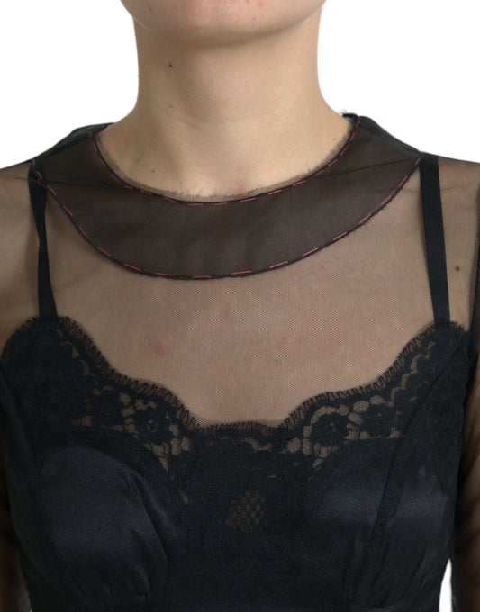 A black mesh tulle gown with floral embroidery detailing