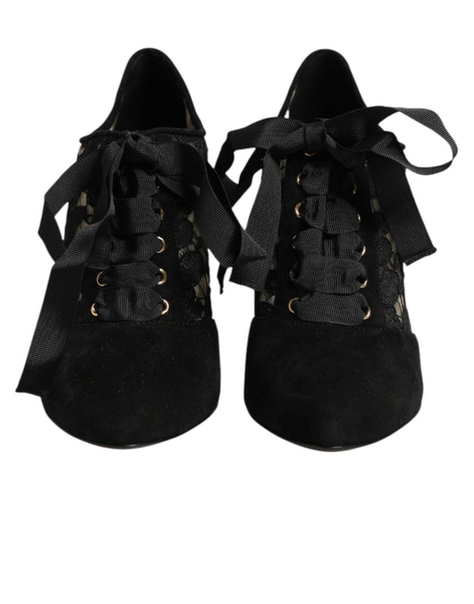 Pair of black velvet shoes with gold buckles