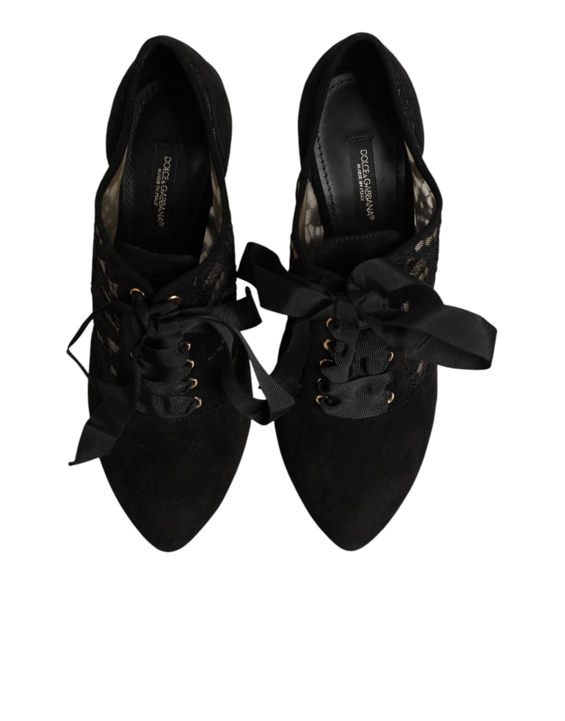 Pair of black sneakers with gold accents