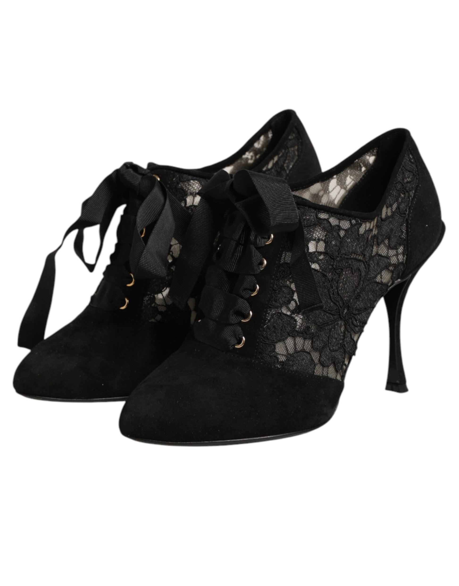 Pair of black lace up boots with gold accents
