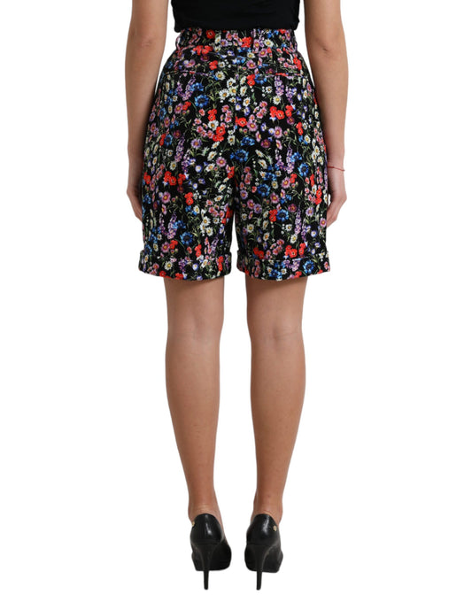 Woman wearing floral shorts and black heels
