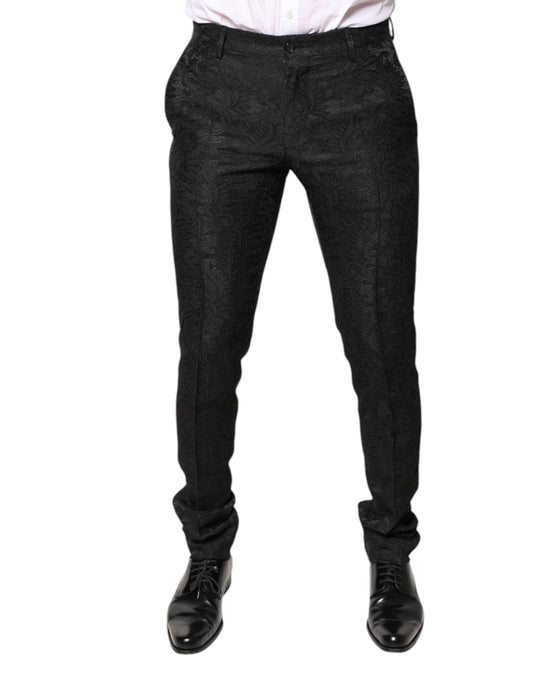 A pair of black dress pants with a floral jacquard pattern. They are mid-waisted and appear to be made by Dol