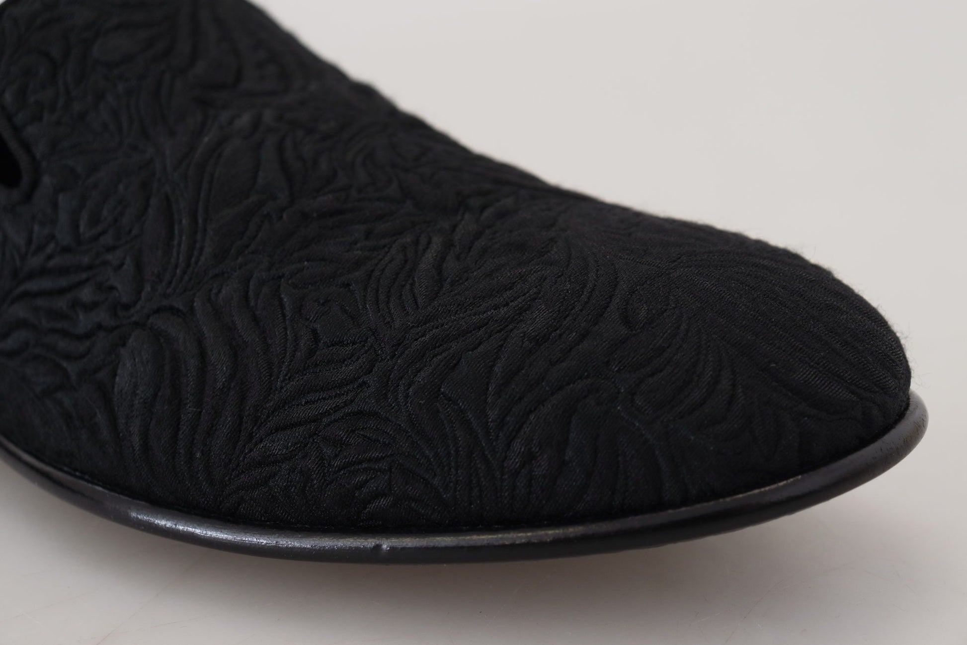 Black velvet slipper with embroidered pattern on top and sole