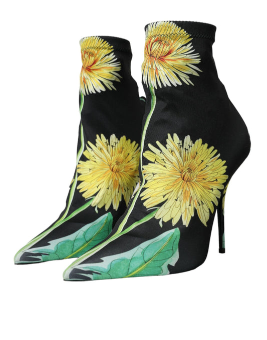 Pair of black high heel boots with yellow flower print