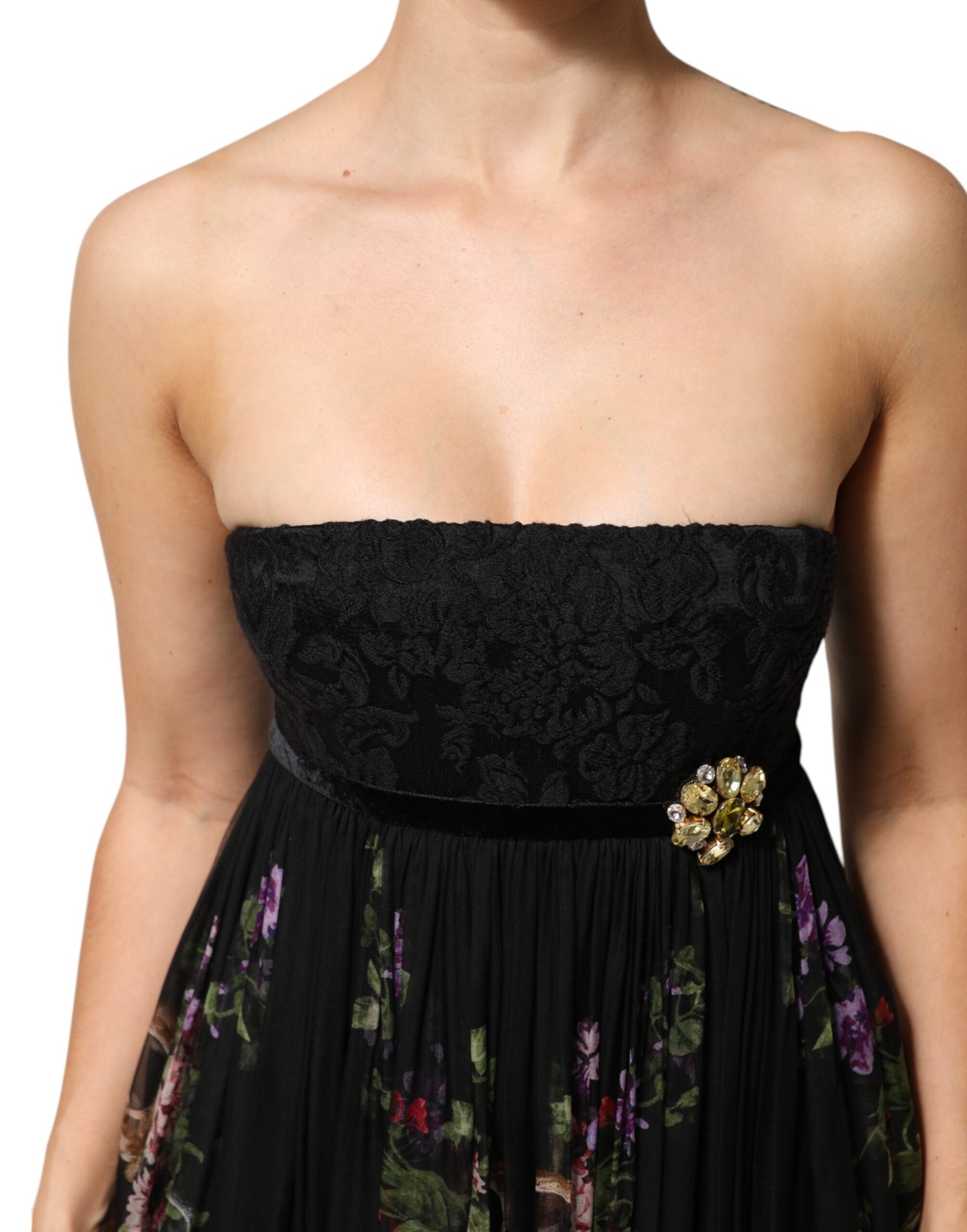 A black strapless dress with floral key print and crystal embellishments