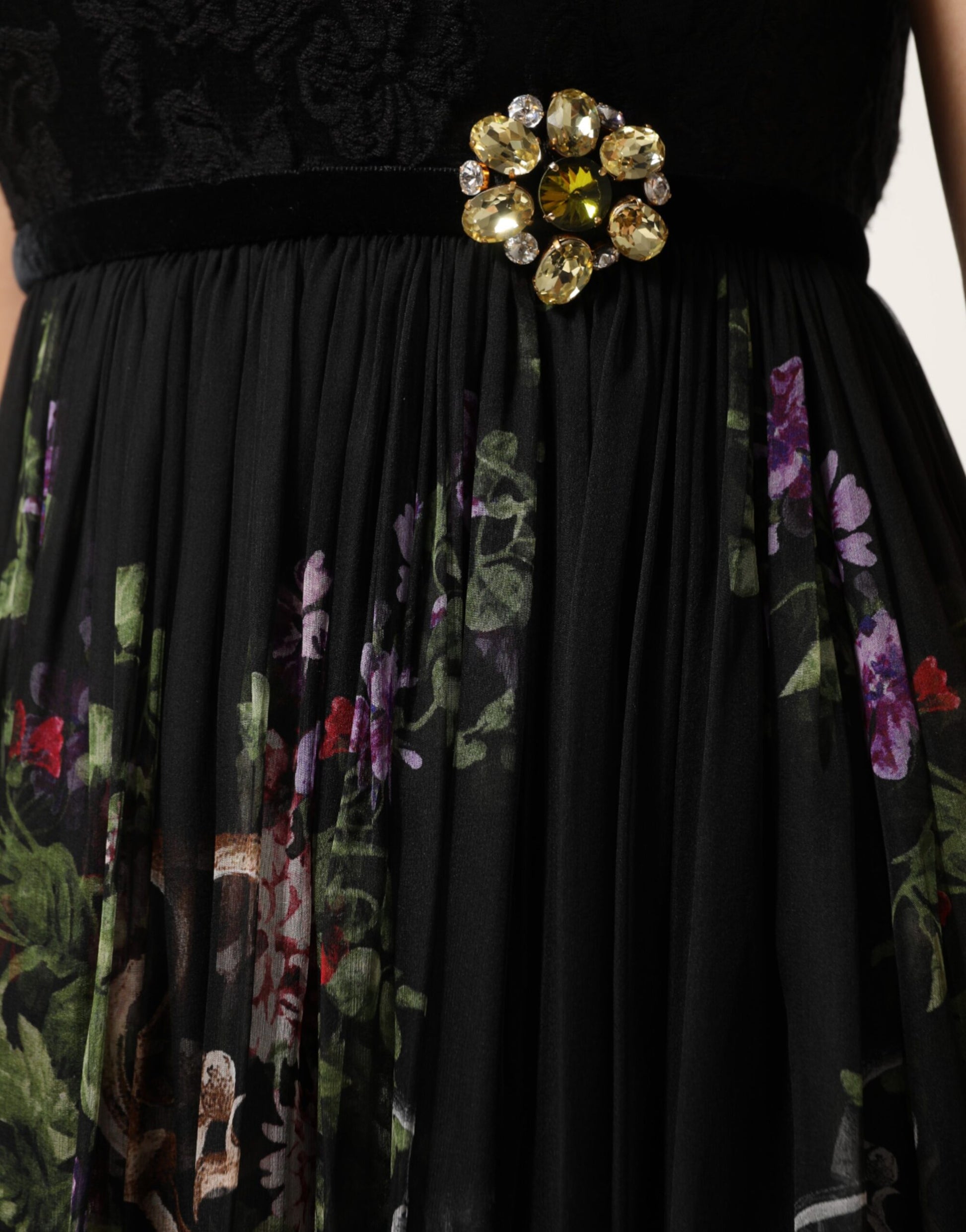 A black strapless dress with a floral key print and crystal embellishments