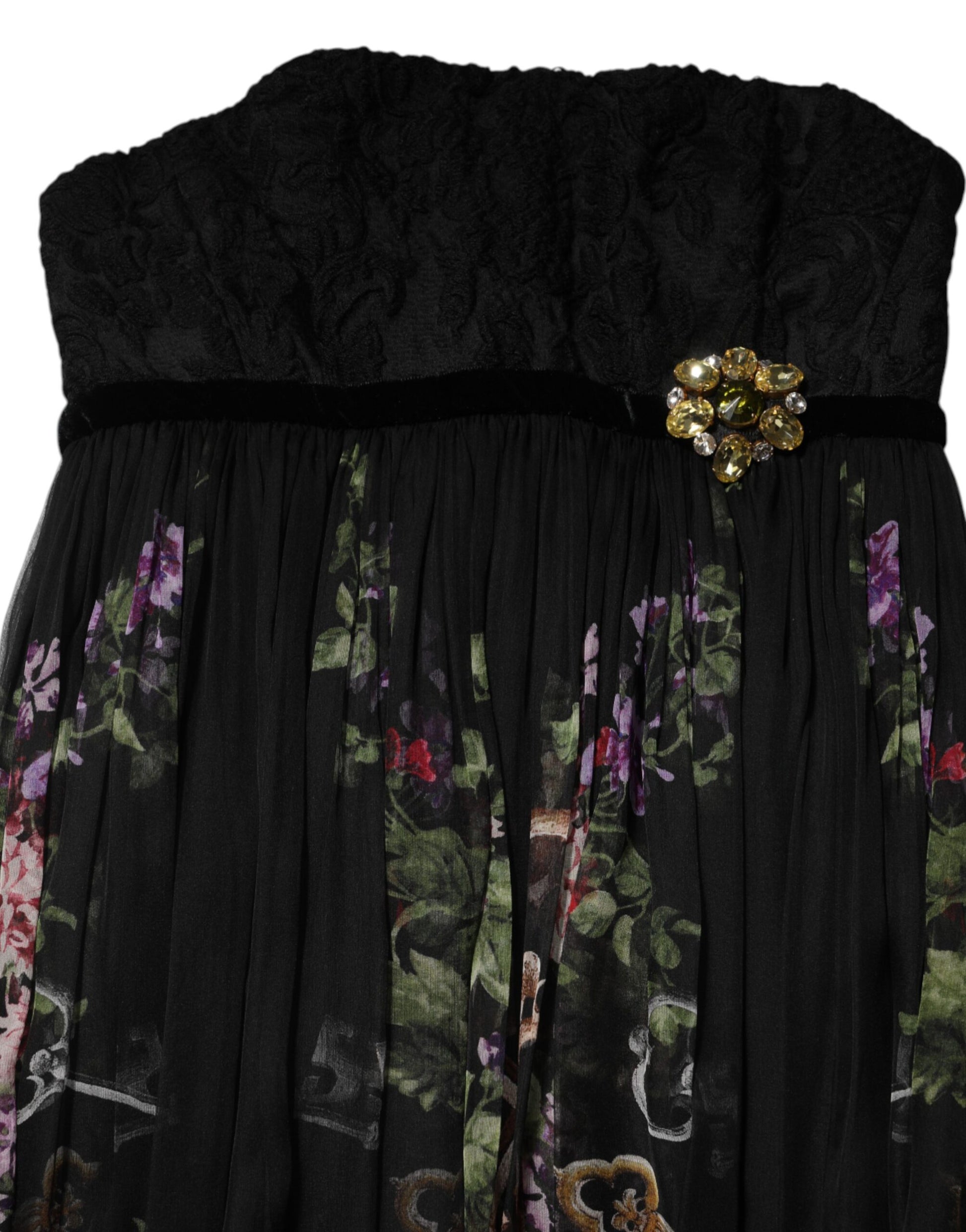 A black floral key print dress with a crystal embellishment on the waist
