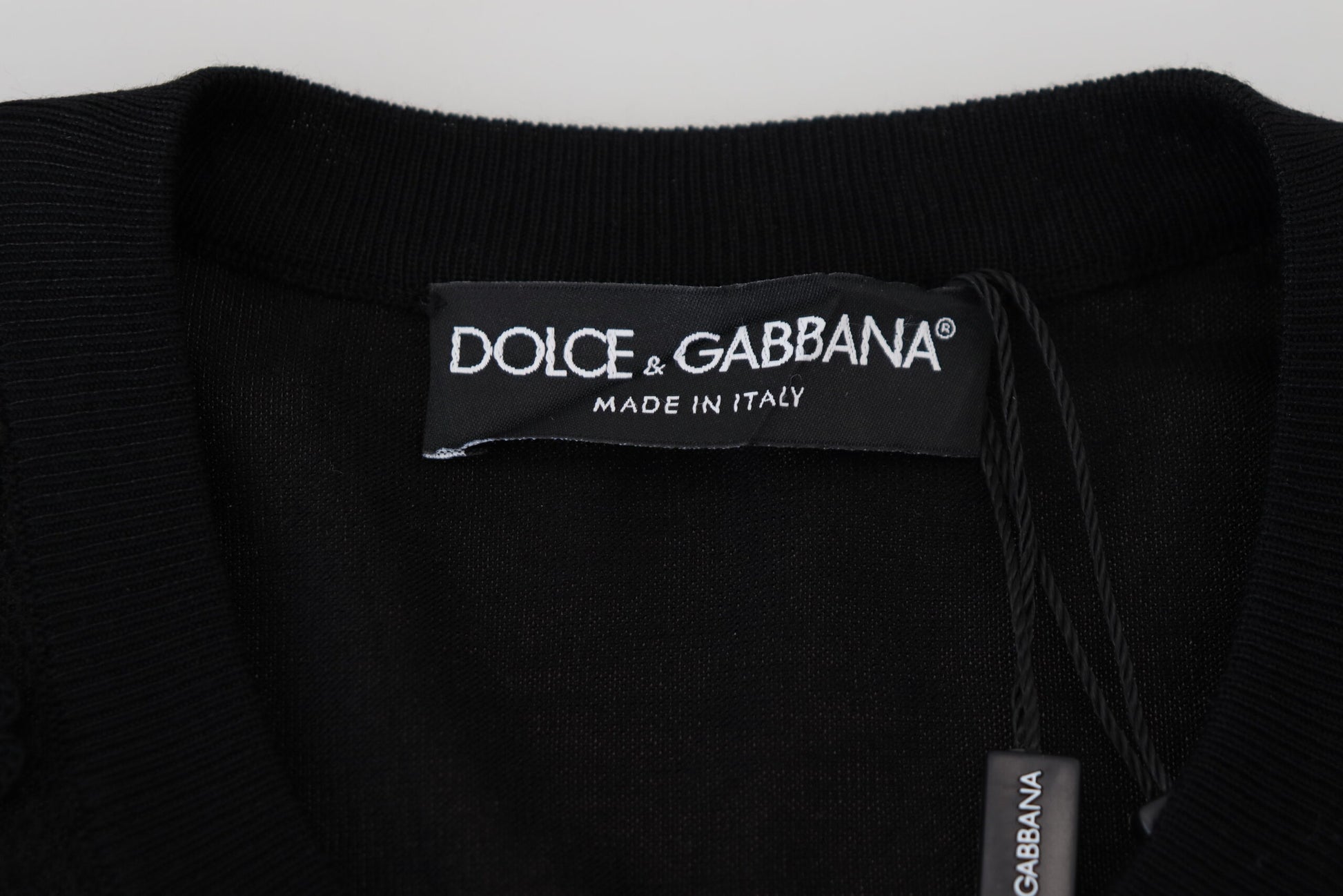 Black turtleneck sweater with white label