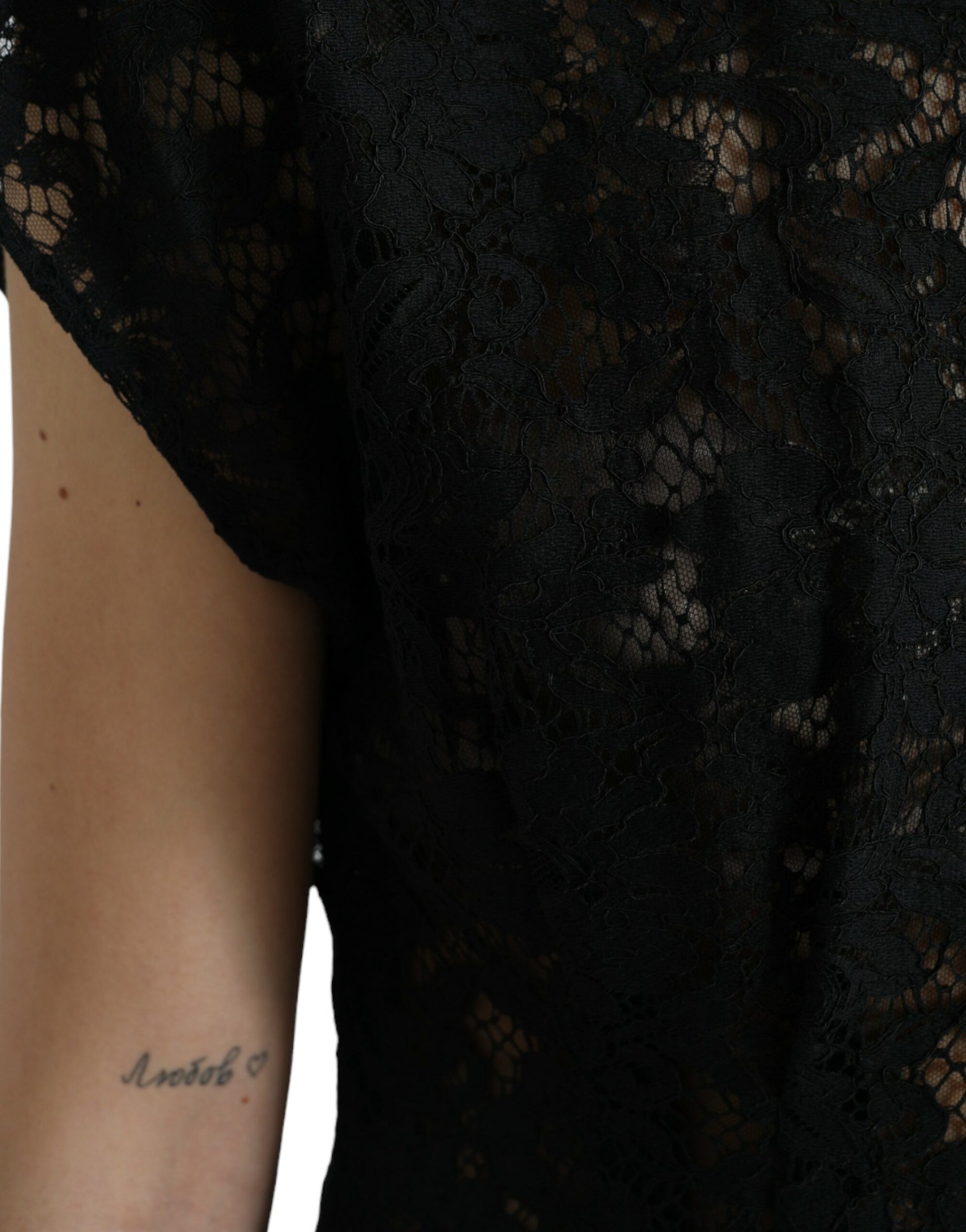 A black lace dress with floral patterns, featuring an A-line silhouette and short sleeves