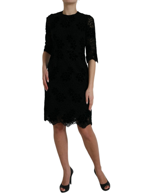 A black lace dress with floral pattern from Dolce & Gabbana, featuring a body-hugging silhouette
