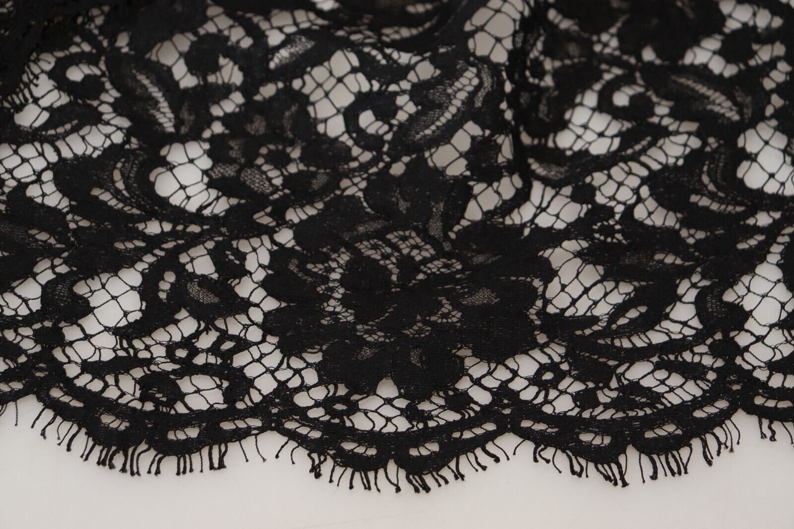 A black lace dress with floral patterns