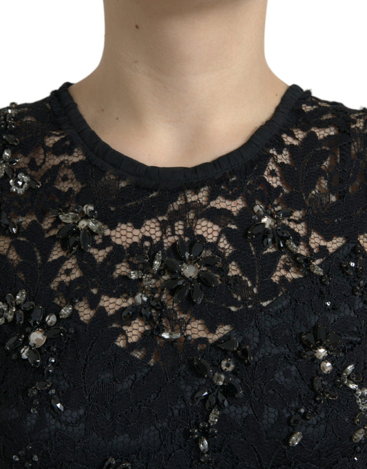 A black lace dress with floral patterns and crystals on the bodice