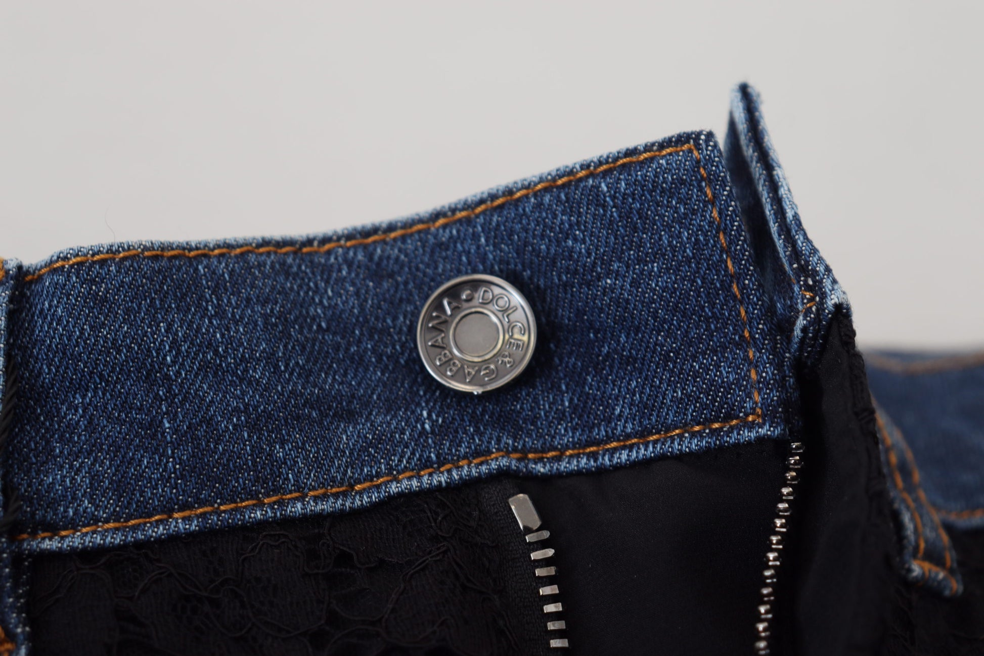 Blue denim jeans with button closure