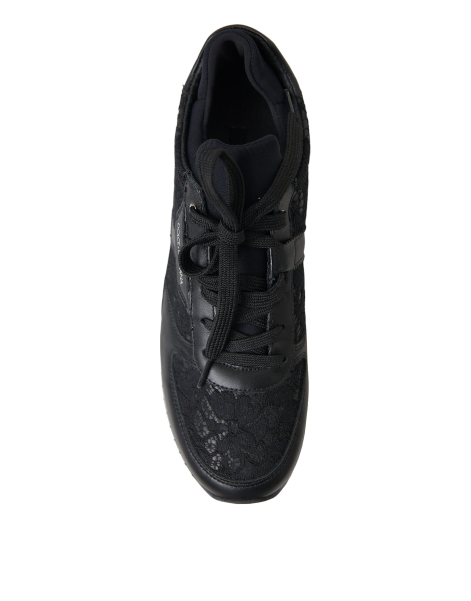Black sneaker with white laces and a patterned sole
