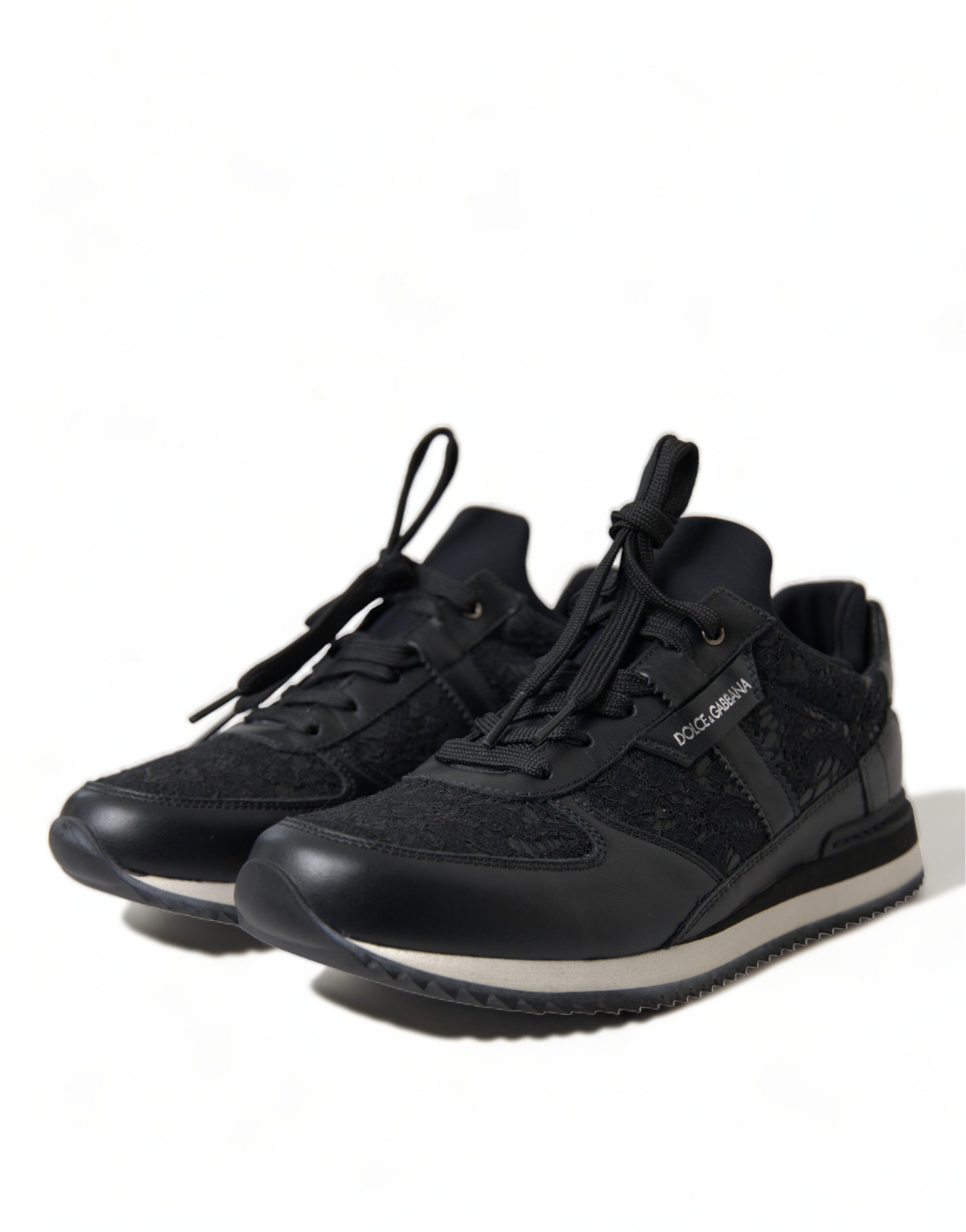 Pair of black hiking boots with white soles and laces