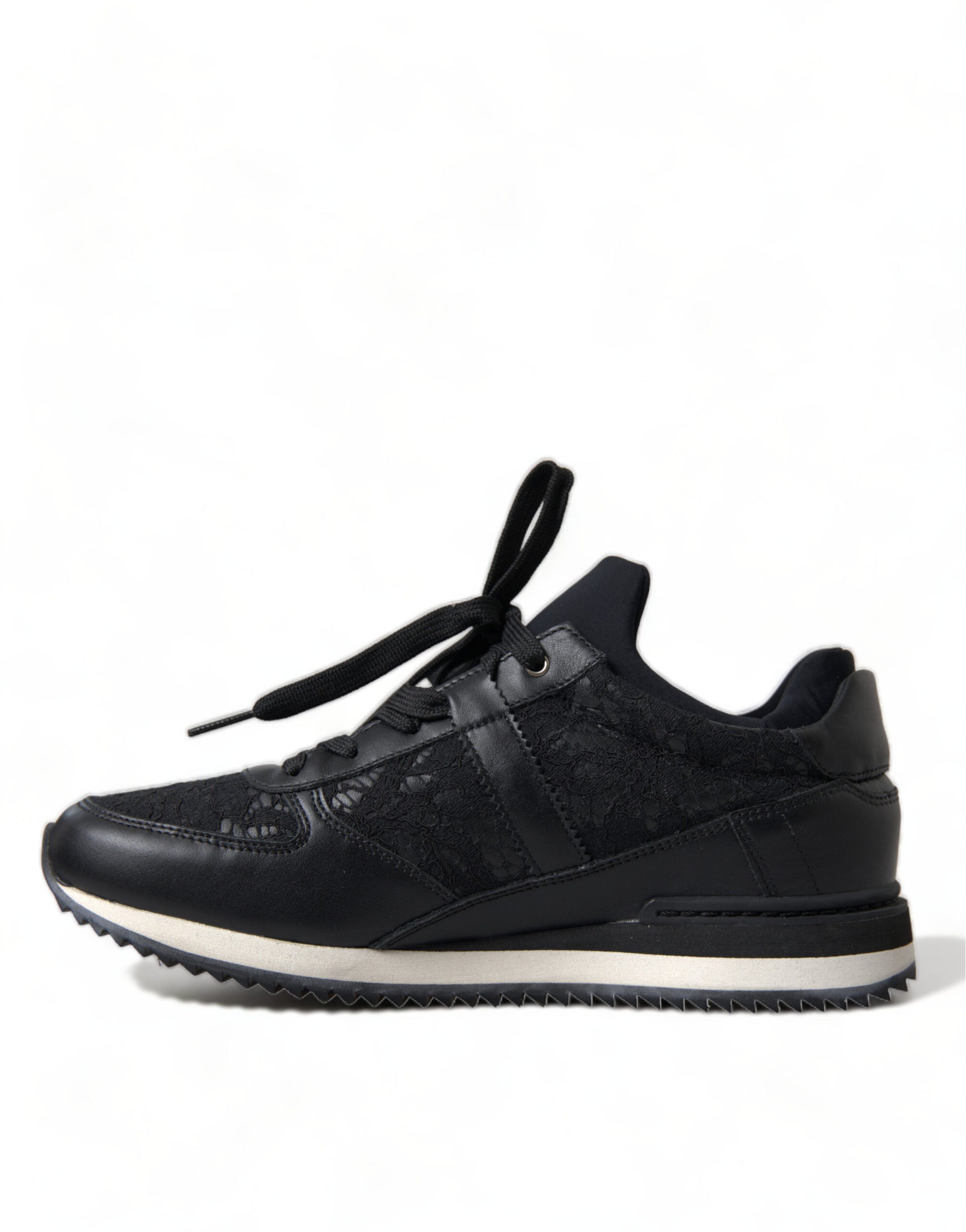 Black sneakers with white sole and laces