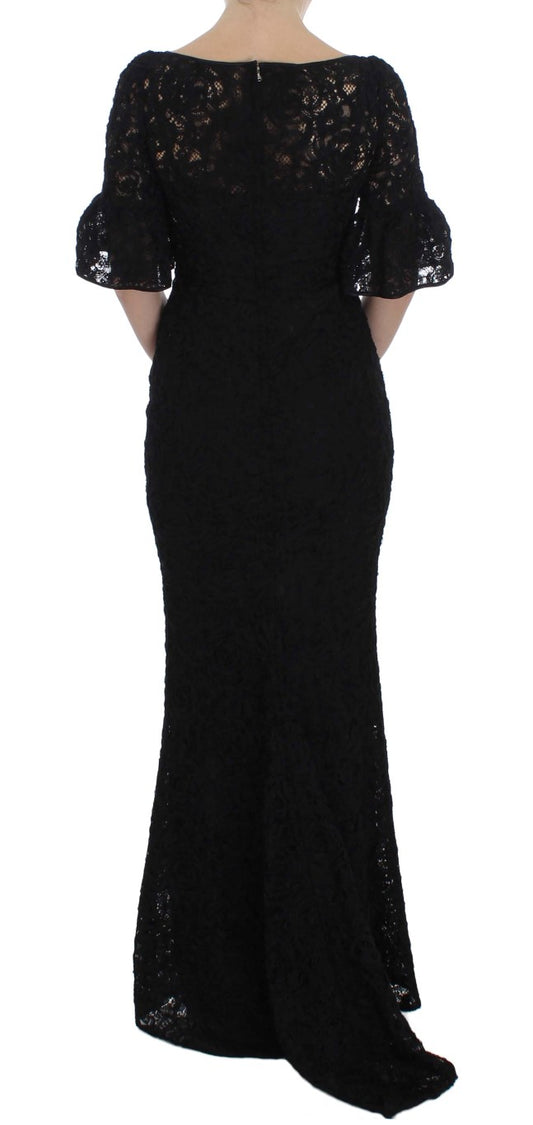 A long black dress with floral lace detailing and a body-skimming silhouette