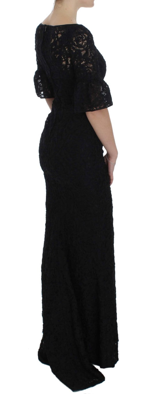A long black dress with floral lace detailing and a body-skimming fit