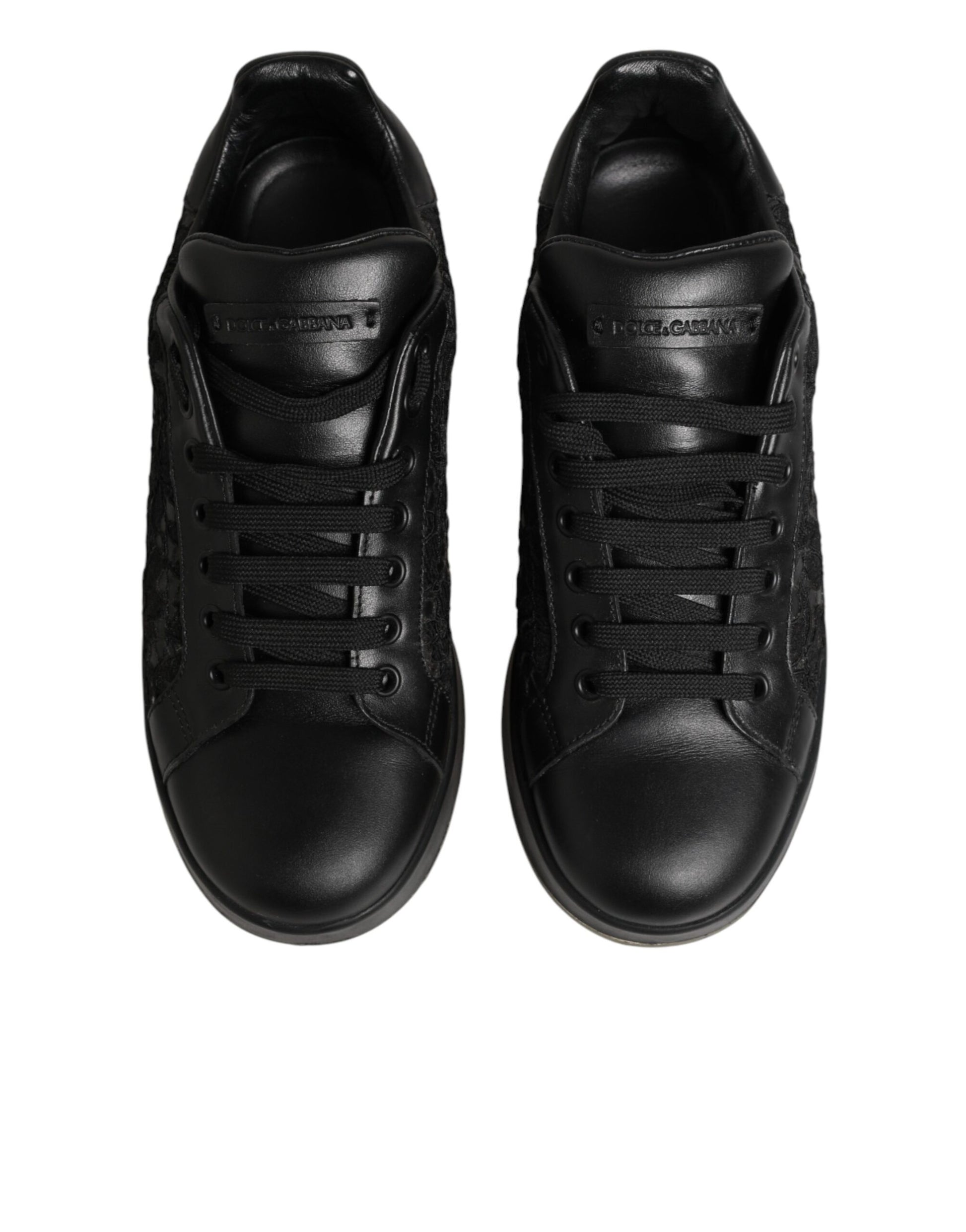 Pair of black lace-up sneakers with floral pattern on side