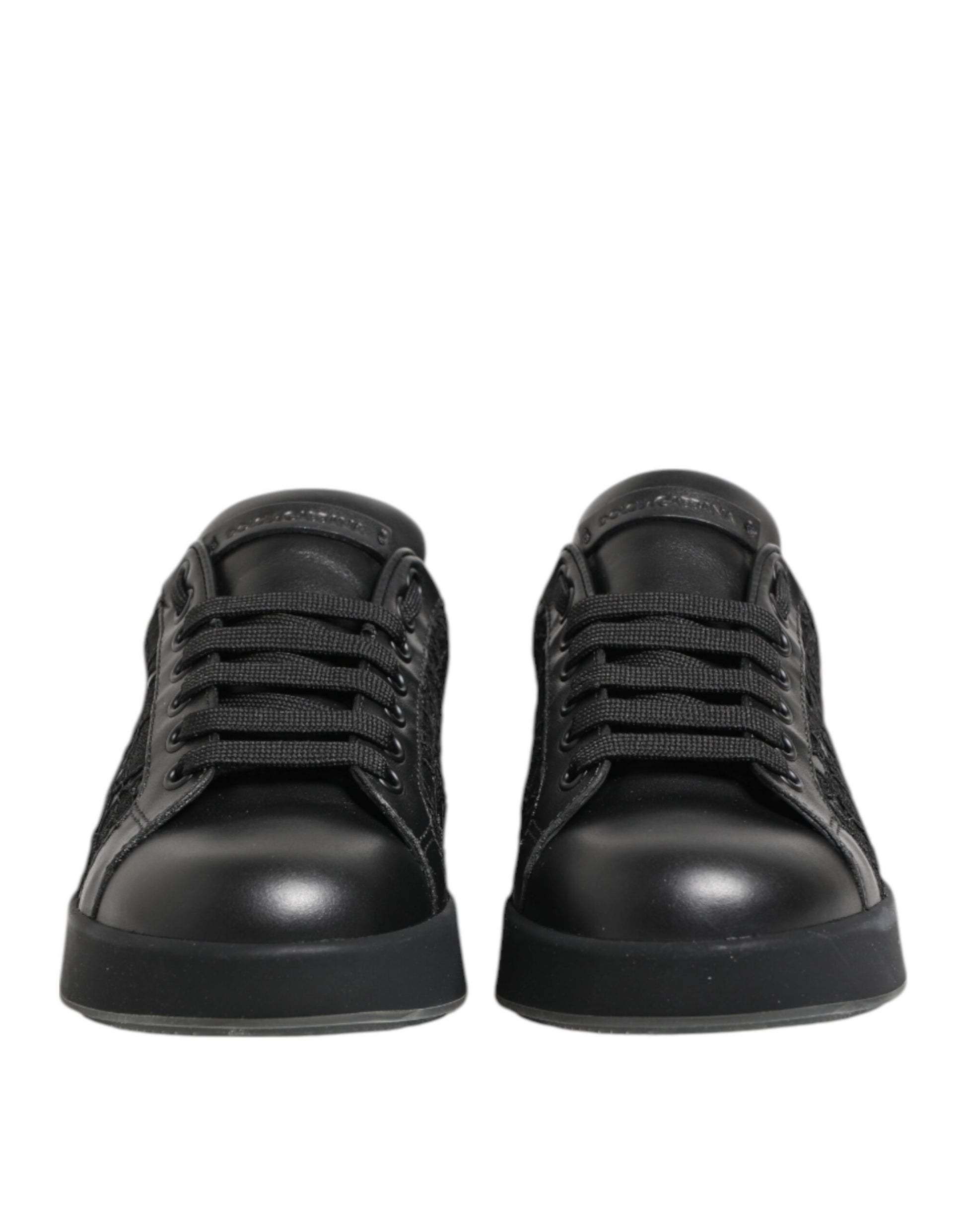 Pair of black children's shoes with laces