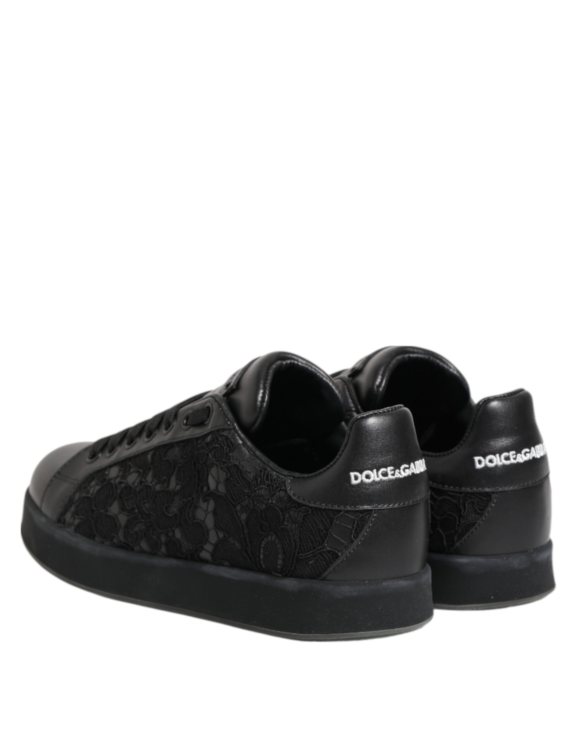 Pair of black sneakers with white laces and soles