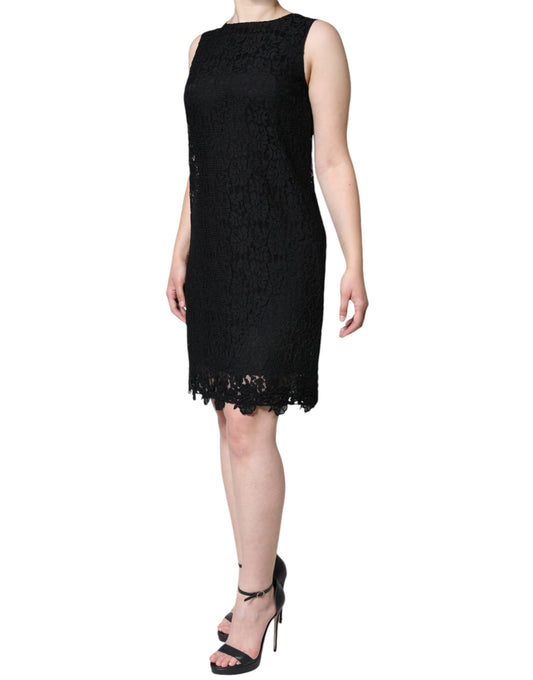 A black lace sheath dress with floral pattern and sleeveless design