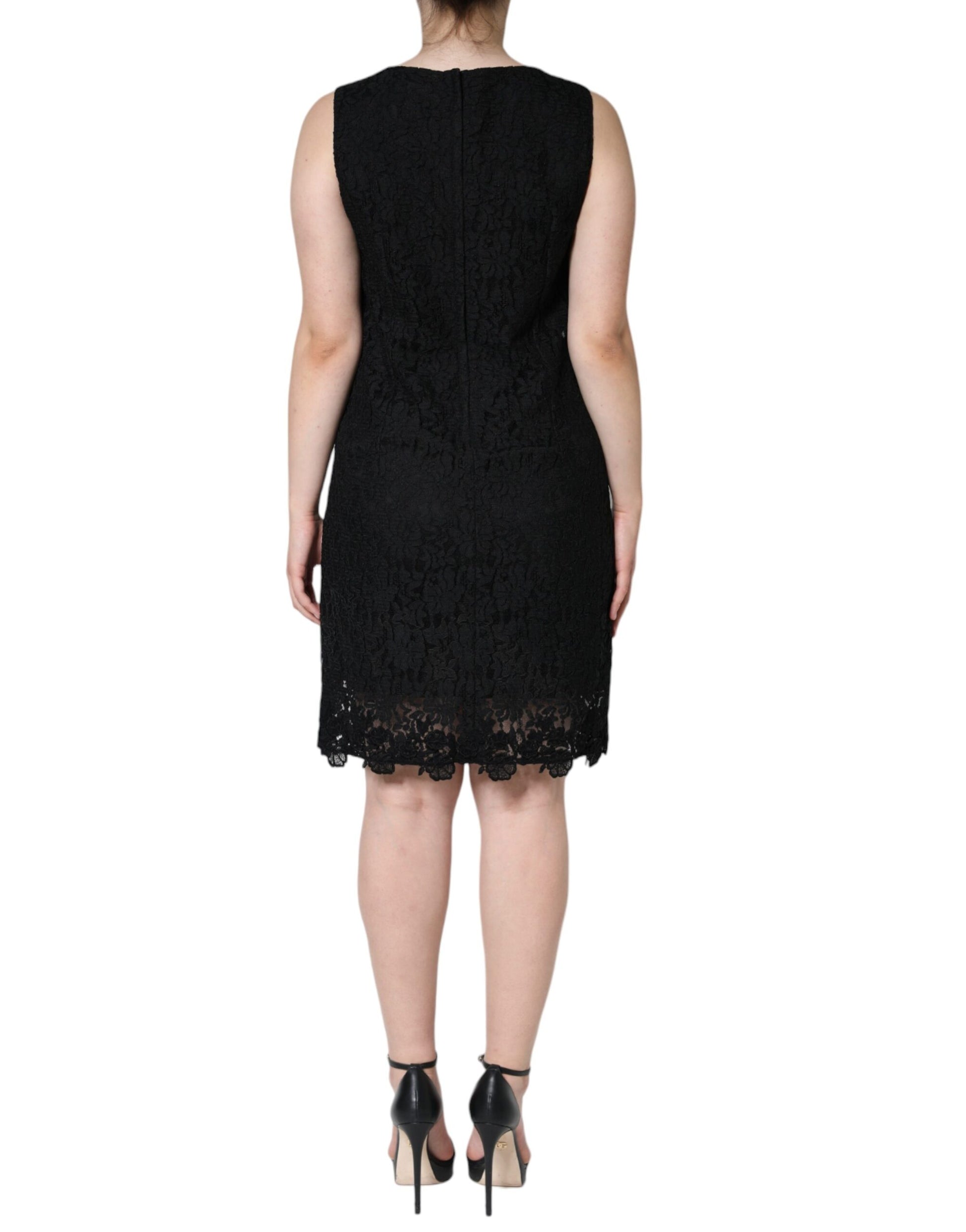 A black lace sheath dress with floral pattern, sleeveless and mini length