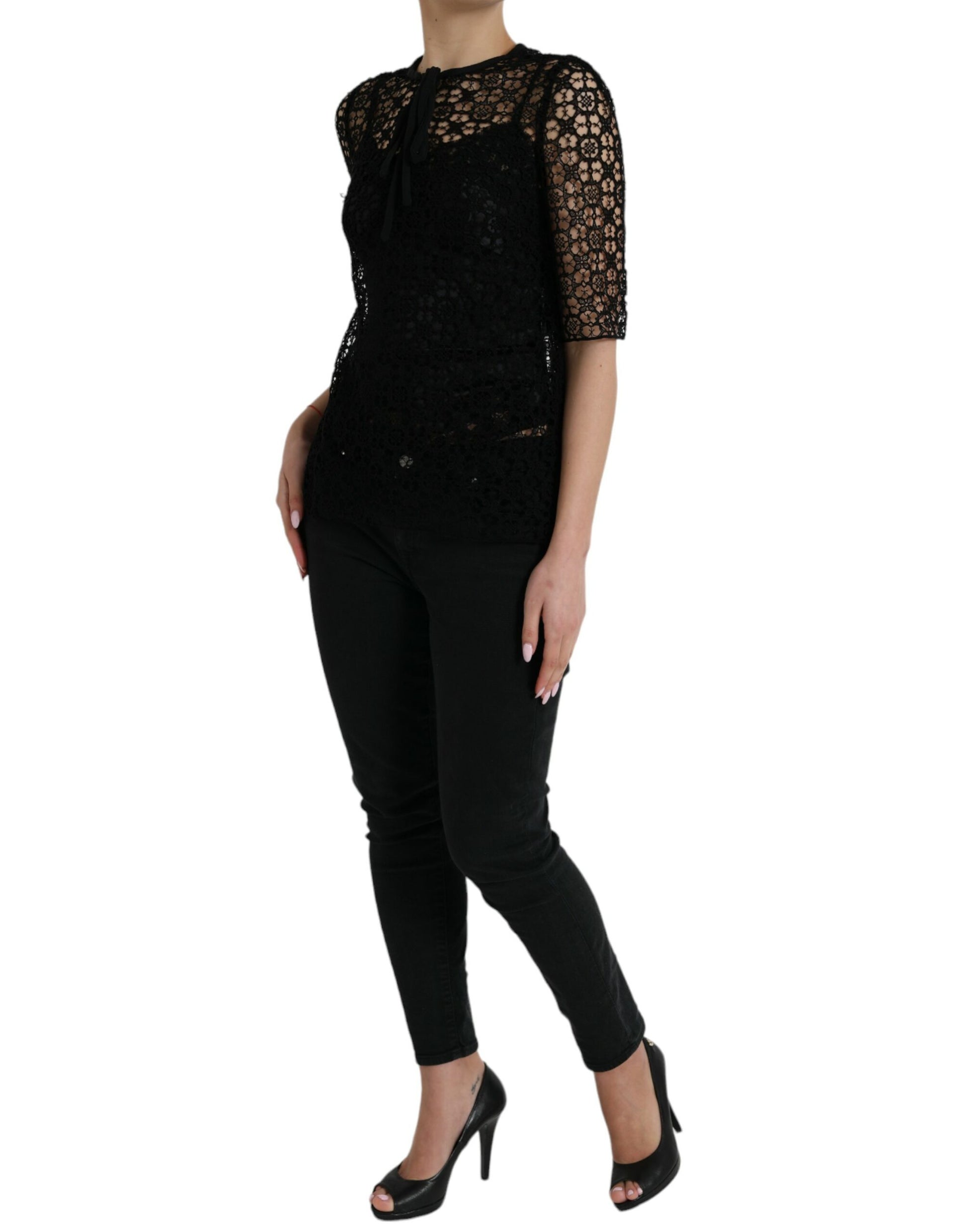 Woman wearing black lace top and pants