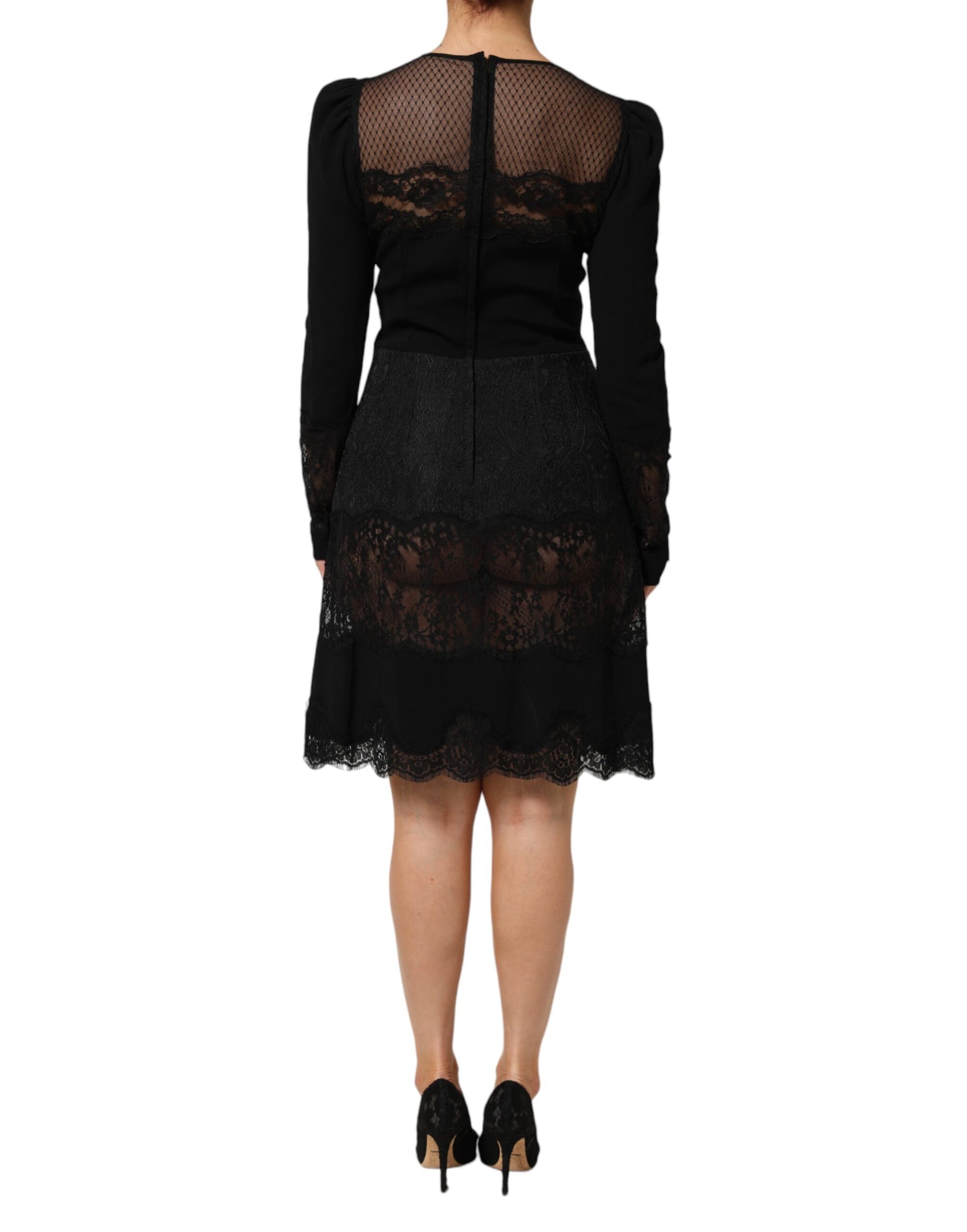 A black sheath dress with lace trim and floral pattern
