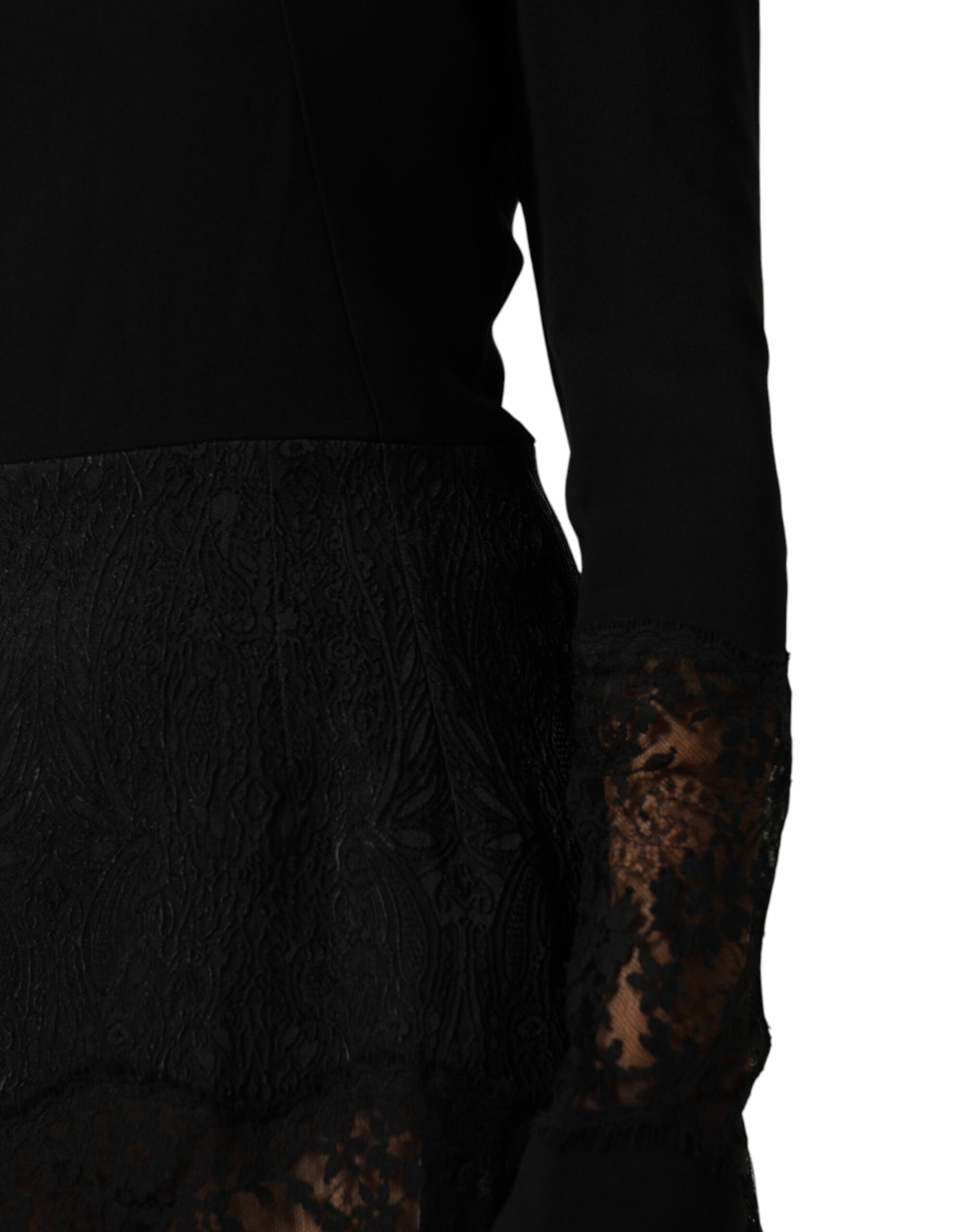 A black lace dress with floral trim, featuring an A-line silhouette